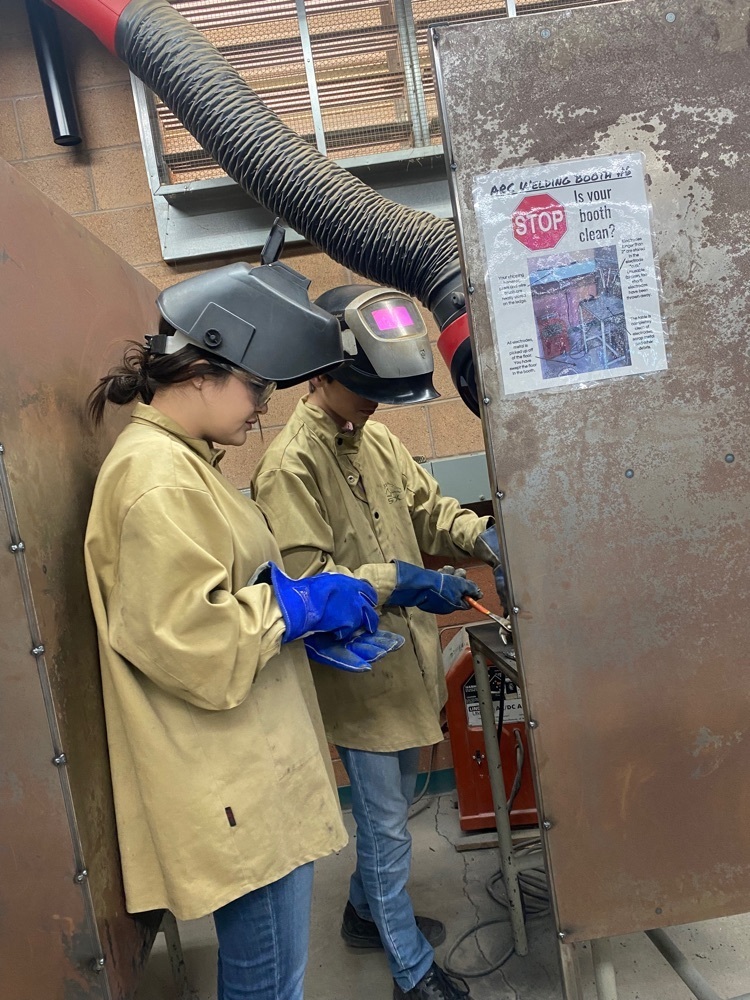 students welding 